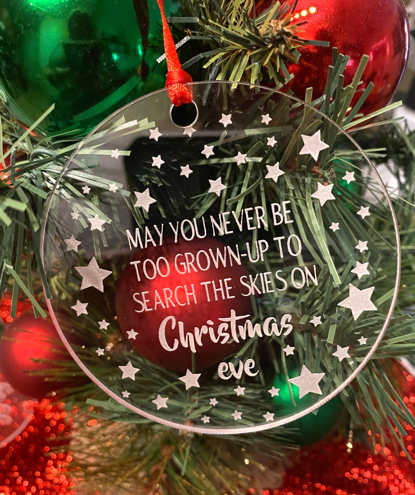 Christmas Ornament, Acrylic, "May you never be too Grown Up to search the skies on Christmas Eve" Stars of various sizes around the ornament,